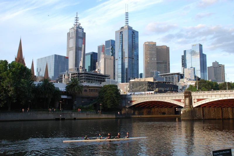 A bridge over the Yarra with the Melbourne skyline behind